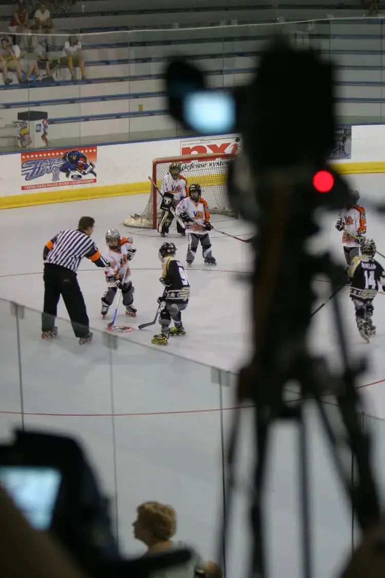 Camera filming a children's hockey game