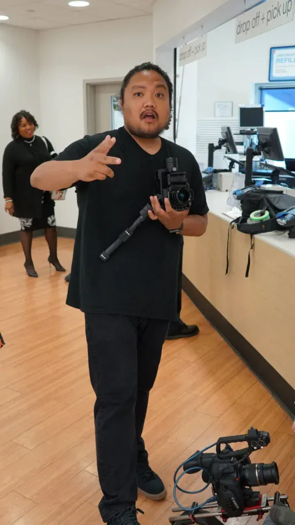 Man with a camera in a hospital check in area