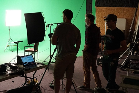 people on a film set behind the scenes