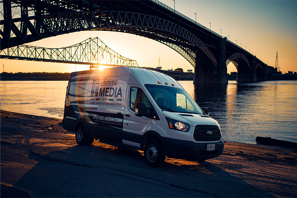 Lifetime Media Van in front of bridge at sunset