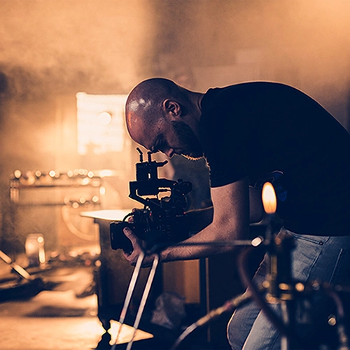 man with camera smoky background